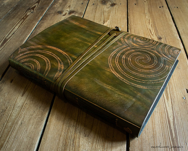 A4 brown and green leather journal with Neolithic triple spiral design 3 - earthworks journals