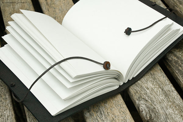 A6 hand bound leather journal - open - earthworks journals