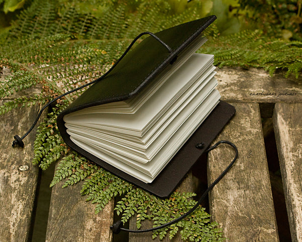 a7 hand bound black leather journal - open - earthworks journals