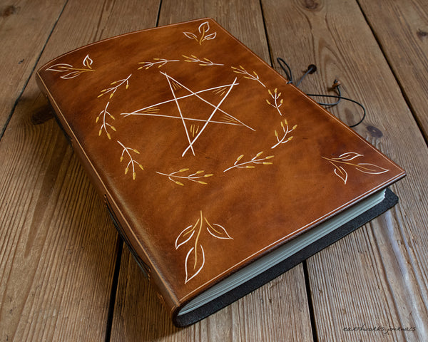A4 brown leather journal with folk pentagram and leaves 1 - earthworks journals