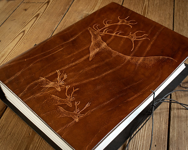 A4 LASCAUX CAVE PAINTING STAGS - BROWN LEATHER JOURNAL 3 - EARTHWORKS JOURNALS