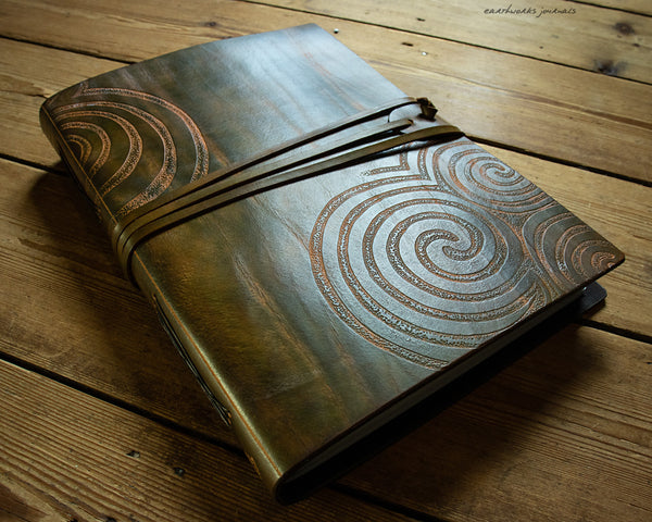 A4 brown and green leather journal with Neolithic triple spiral design - earthworks journals