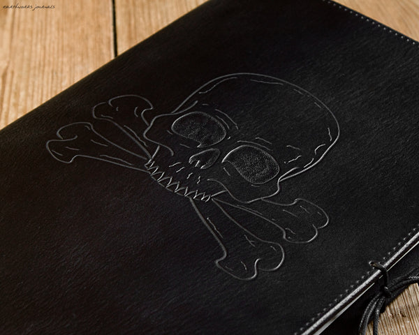 A4 black leather journal - ship's log - skull and crossbones design detail - earthworks journals A4C015
