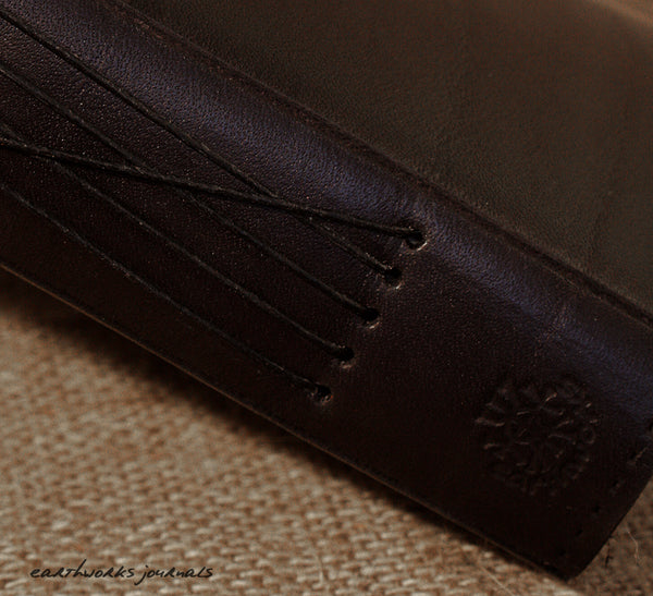 a6 black leather journal - spine - earthworks journals