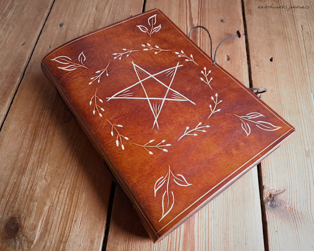 A5 brown leather journal with pentagram and leaves 1 - earthworks journals