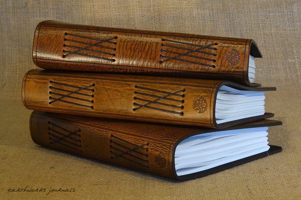 A5 brown leather journals spines - earthworks journals